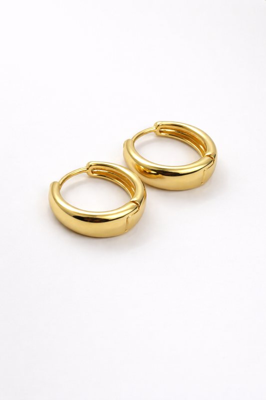 The Cashew Huggie Hoop Earrings in Gold Tone
