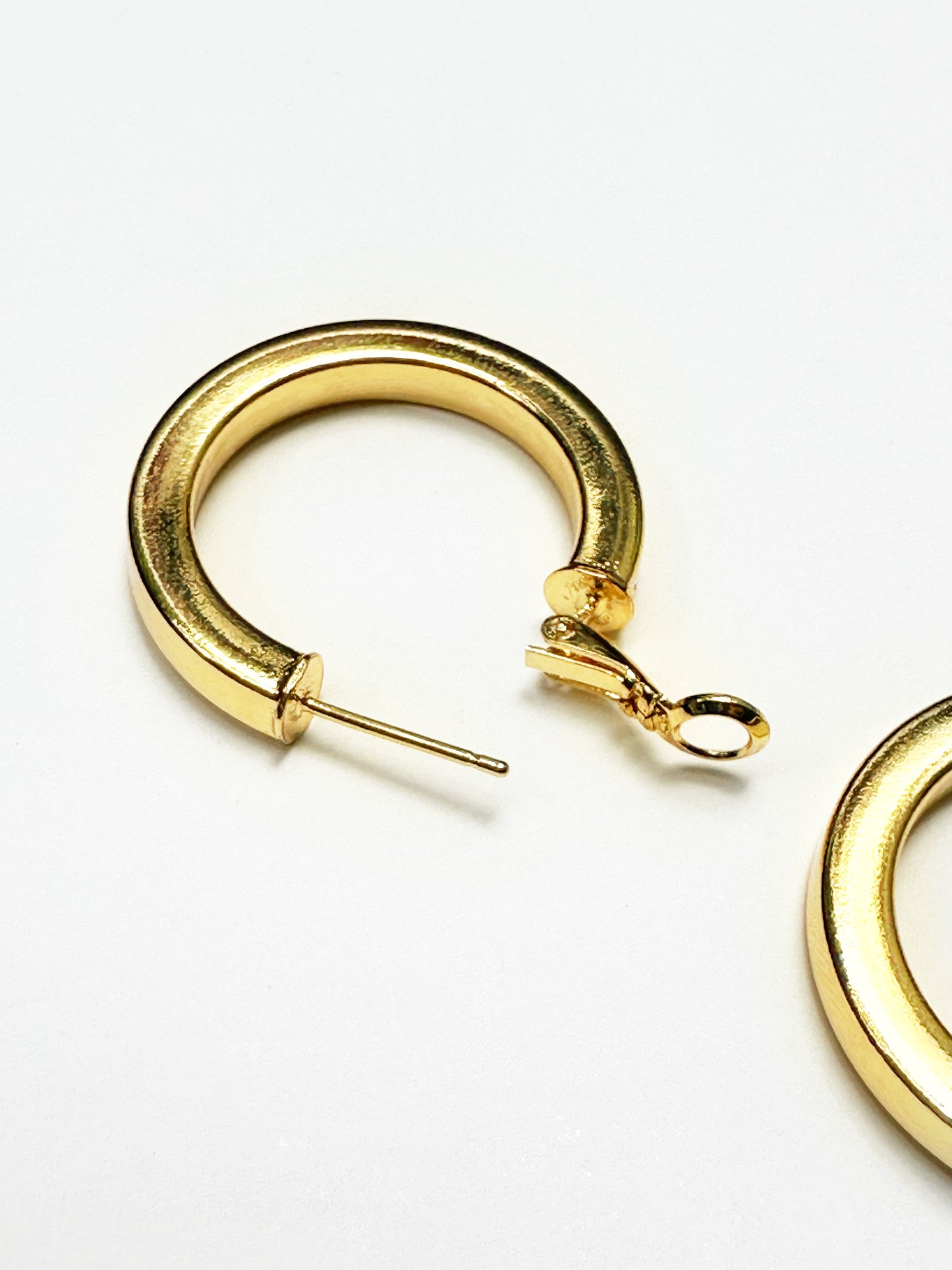 Non-tarnish gold-plated hoop earring showing secure clasp and hollow interior