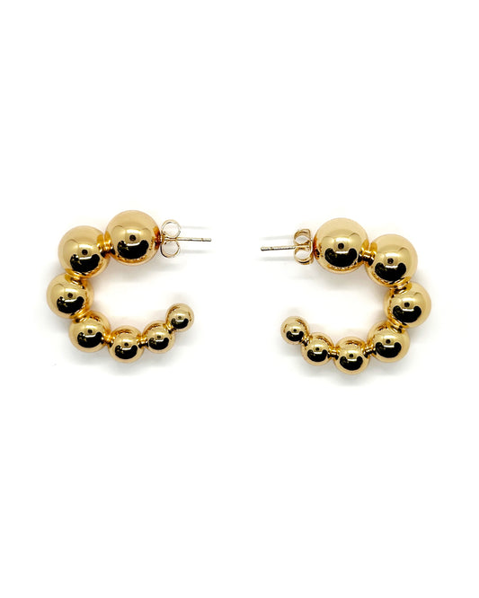Front view of gold-plated chunky beaded hoop earrings with post-backs