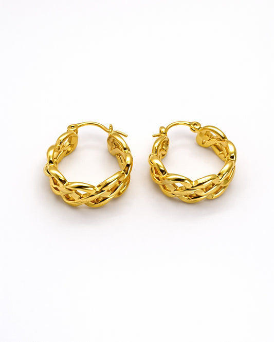 Pair of gold hoop earrings on a white background