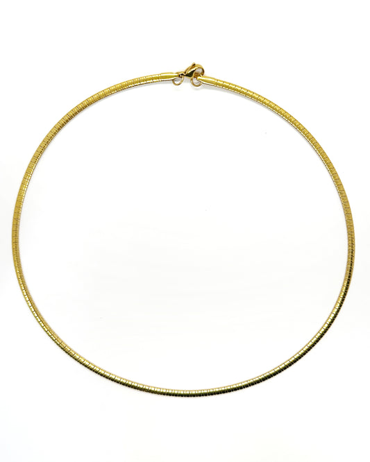 Flat snake chain necklace in 18K gold-plated stainless steel, displayed on white background