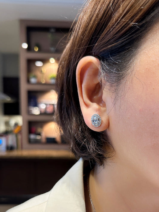 Close-up of Oval Halo Illusion Stud Earring worn on the ear, showing brilliant sparkle