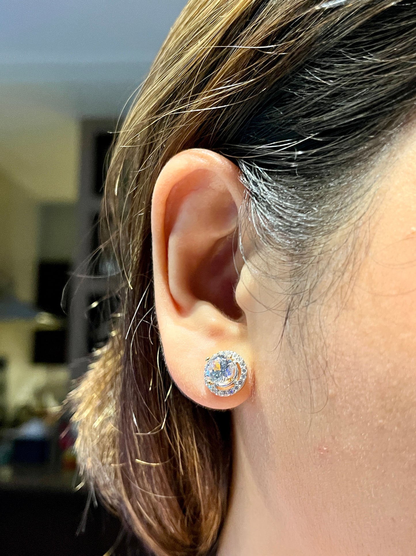 Model wearing the Radiant Halo Stud Earrings for a classic everyday look