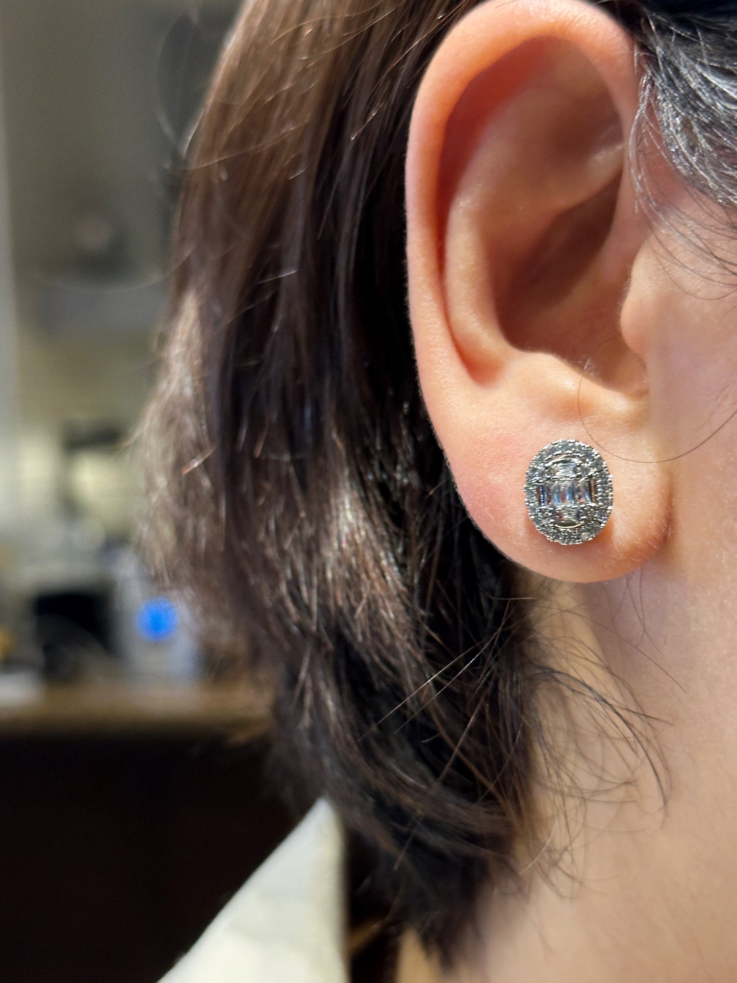 Zoomed-in image of oval stud emphasizing cubic zirconia halo setting