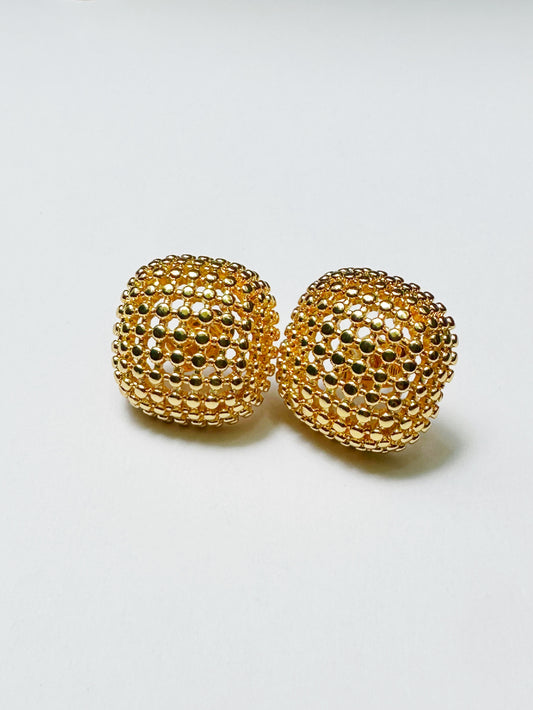 Pair of gold-tone textured dome earrings on white background, front view