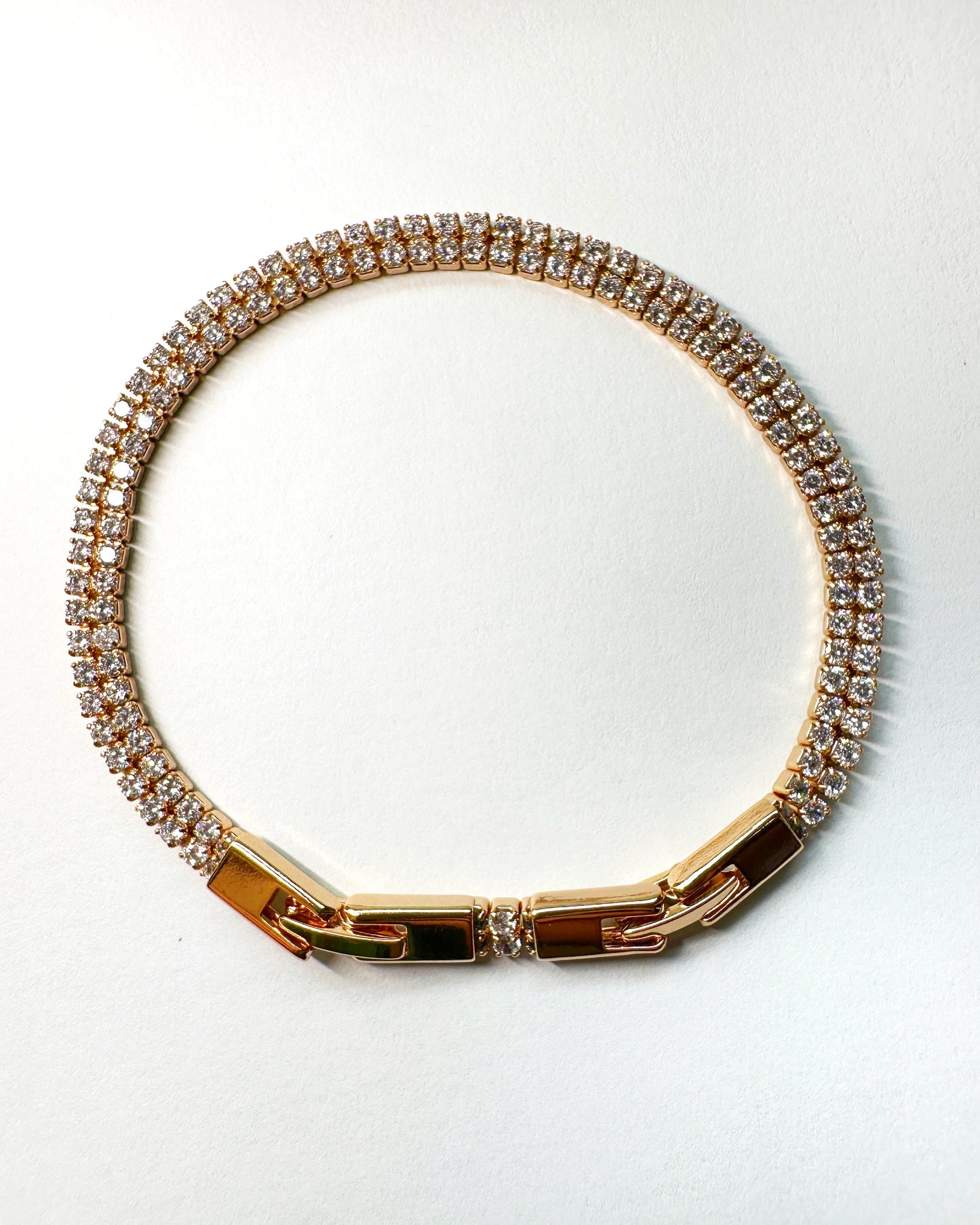 Bracelet clasp detail showing polished gold elements