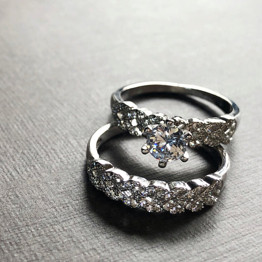 Close-up of solitaire and band shimmering under light