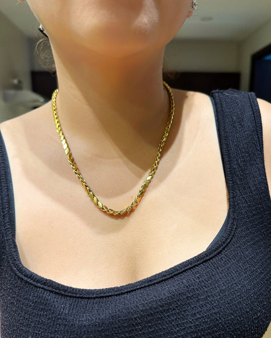 Gold marquise link necklace worn on model