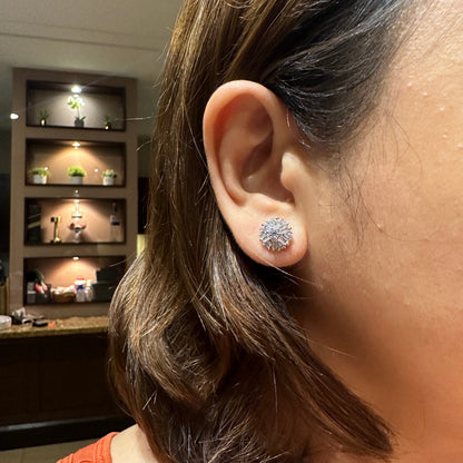 Snowflake stud earrings worn on ear lightweight everyday jewelry