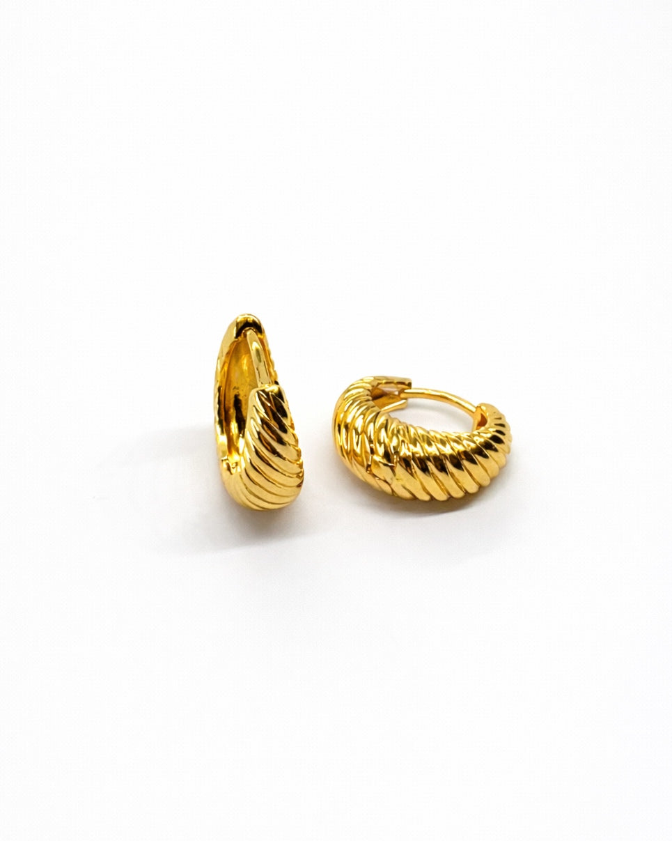 Back view of 18K gold tone twisted shell huggie earrings showing clasp mechanism