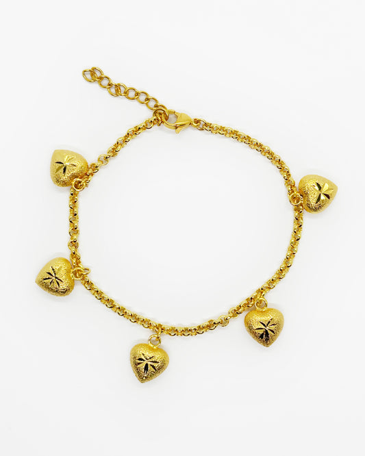 Frosted engraved heart charm chain bracelet in 18K gold-dipped hypoallergenic metal on white background