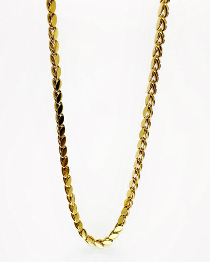 Gold marquise link chain necklace on white background