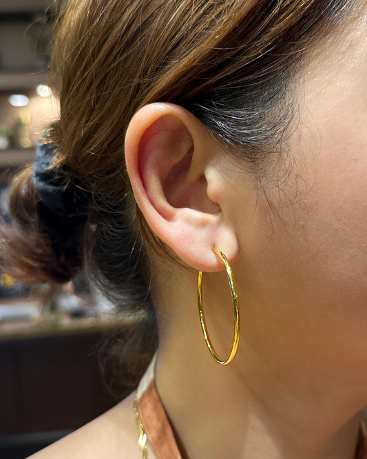 woman wearing 1.8 inch thin gold hoop earrings stainless steel everyday jewelry look