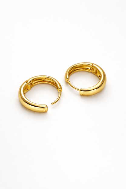 The Cashew Huggie Hoop Earrings in Gold Tone