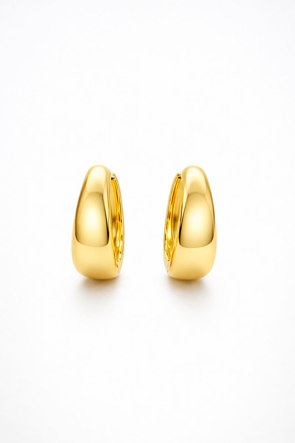 The Cashew Huggie Hoop Earrings in Gold Tone