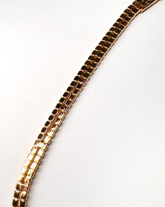 Rear view showing smooth gold-tone link construction