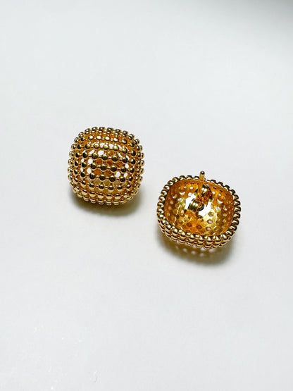Inside view of stainless steel mesh earrings showing lightweight dome structure