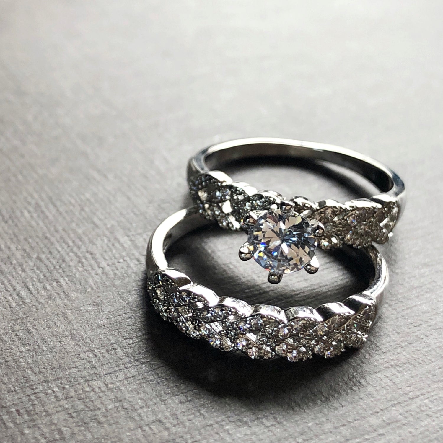 Close-up of solitaire and band shimmering under light