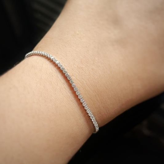 hand wearing whitegold silver petite tennis bracelet